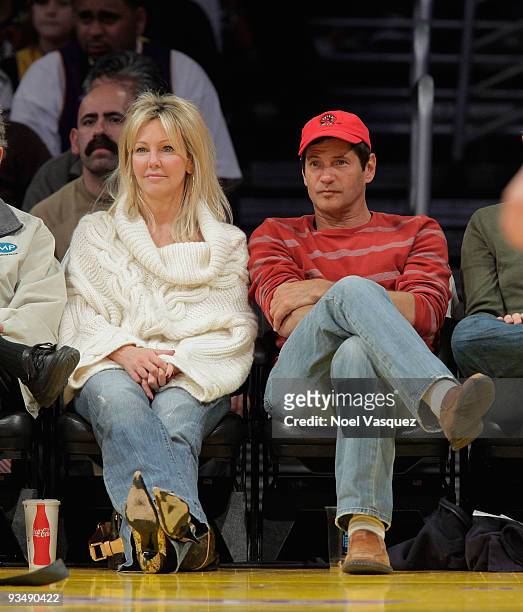 Heather Locklear and Thomas Calabro attend a game between the New Jersey Nets and the Los Angeles Lakers at Staples Center on November 29, 2009 in...