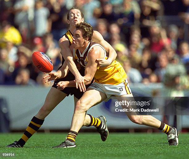 Bill Nicholls for Box Hill is tackled by Robert Murphy for Werribee during the VFL Grand Final between the Werribee Tigers and the Box Hill Hawks...