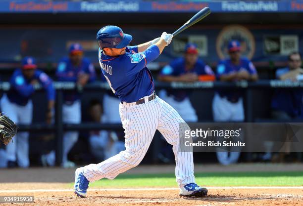 Travis d'Arnaud of the New York Mets in action during a spring training game against the Houston Astros at First Data Field on March 6, 2018 in Port...