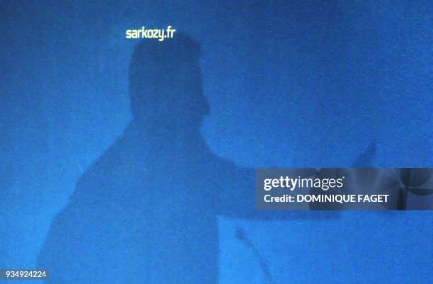 Picture taken 02 April 2007 of a shadow of French right-wing presidential candidate of the ruling Union for a Popular Movement Nicolas Sarkozy on a...