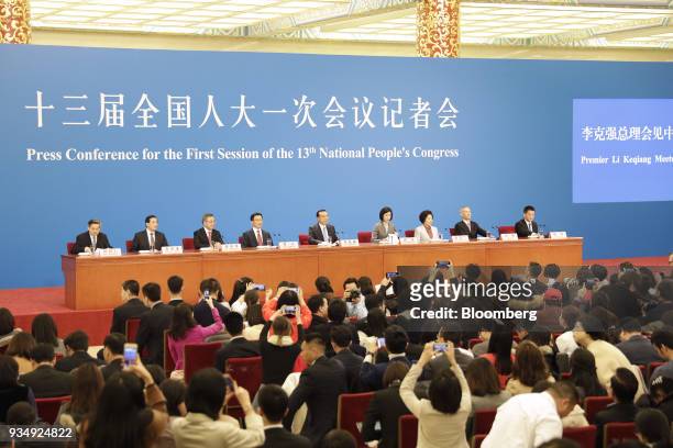 Li Keqiang, China's premier, center, speaks as Hu Chunhua, China's vice premier, third left, Han Zheng, China's executive vice premier, fourth left,...