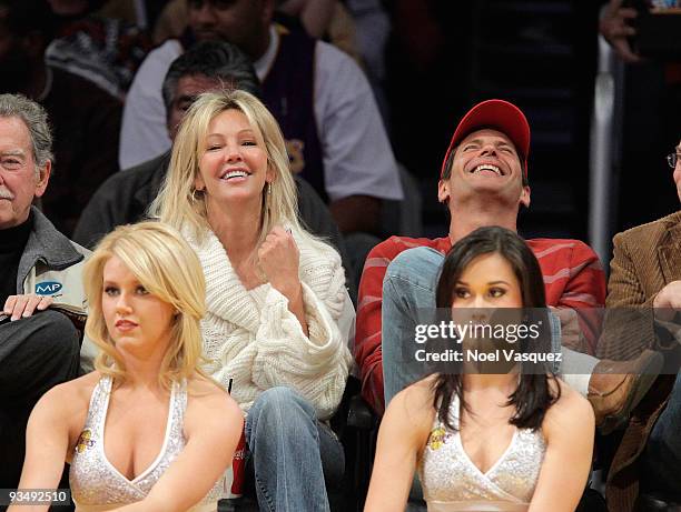 Heather Locklear and Thomas Calabro attend a game between the New Jersey Nets and the Los Angeles Lakers at Staples Center on November 29, 2009 in...