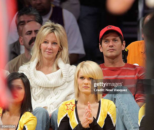 Heather Locklear and Thomas Calabro attend a game between the New Jersey Nets and the Los Angeles Lakers at Staples Center on November 29, 2009 in...