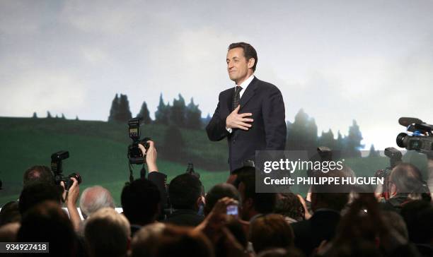 French right-wing presidential candidate Nicolas Sarkozy arrives on the stage of the Zenith of Lille to hold a meeting as part of his political visit...