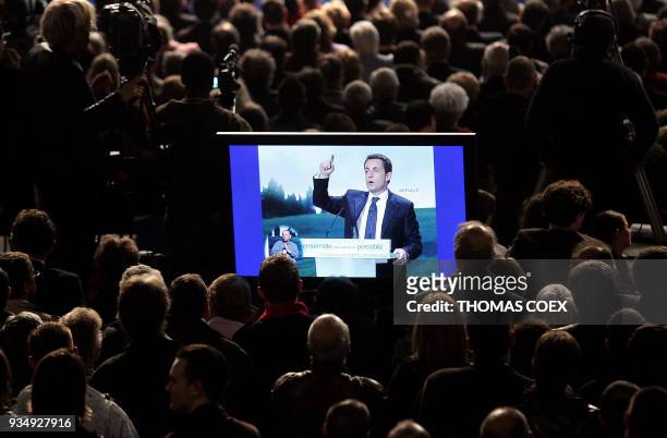 French right-wing candidate for the upcoming 2007 presidential elections Nicolas Sarkozy is seen in a screen as he delivers a speech during a...
