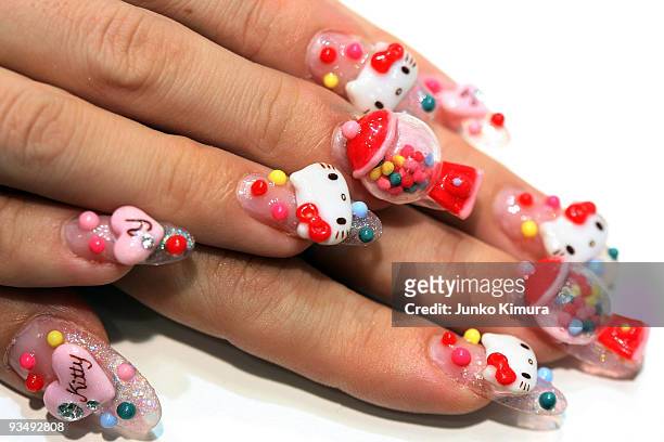 Nail artist shows her 'Hello Kitty' nails during the Tokyo Nail Expo 2009 at Tokyo Big Sight on November 30, 2009 in Tokyo, Japan. The nail industry...