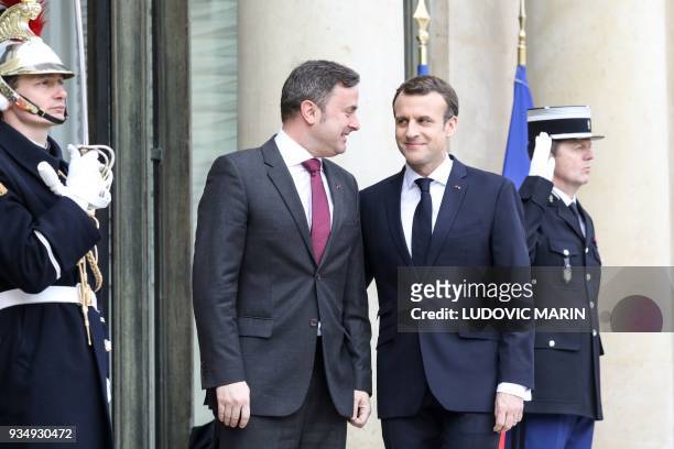 French president Emmanuel Macron welcomes Luxembourg Prime Minister Xavier Bettel upon his arrival at the Elysee presidential palace prior to their...