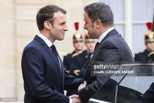 French president Emmanuel Macron welcomes Luxembourg Prime Minister Xavier Bettel upon his arrival at the Elysee presidential palace prior to their...