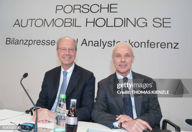 Hans Dieter Poetsch , CEO of Porsche Automobil Holding SE, and Matthias Mueller, member of the executive board for strategy and corporate...