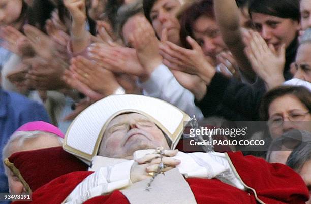 The Pope's body is carried to be transfered from the Apostolic Palace to St Peter's Basilica, 04 April 2005 at the Vatican City. After the solemn...