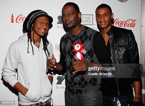 Recording artist Brian McKnight and sons attend the 2009 Hollywood Christmas Parade on November 29, 2009 in Hollywood, California.