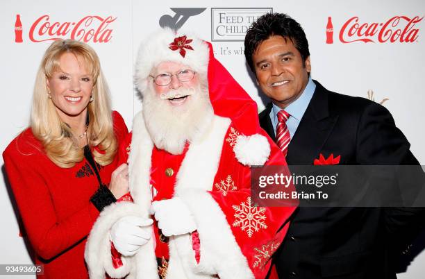 Laura McKenzie, Santa Claus, and Erik Estrada attend the 2009 Hollywood Christmas Parade on November 29, 2009 in Hollywood, California.