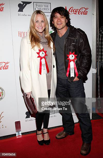 Julie Berman and Dominic Zamprogna attend the 2009 Hollywood Christmas Parade on November 29, 2009 in Hollywood, California.