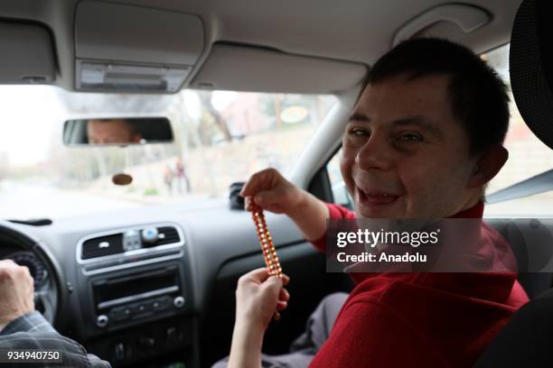 Year-old man with down syndrome Cengizhan Donmez is seen in a car on the way to his office after attending his training session in Ankara, Turkey on...