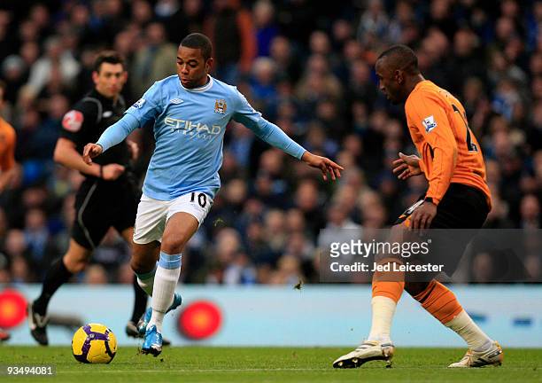 Robinho of Manchester City and Kamil Zayette of Hull City during the Barclays Premier League match between Manchester City and Hull City at the City...