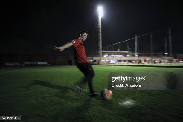 Year-old man with down syndrome Cengizhan Donmez attends a football training session at night in Ankara, Turkey on March 20, 2018. Donmez who won...