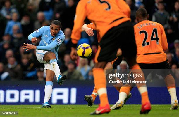 Robinho of Manchester City hits a shot through the Hull City players during the Barclays Premier League match between Manchester City and Hull City...