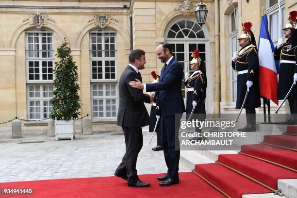 French Prime Minister Edouard Philippe welcomes Luxembourg Prime Minister Xavier Bettel upon his arrival at the Hotel de Matignon prior to a...