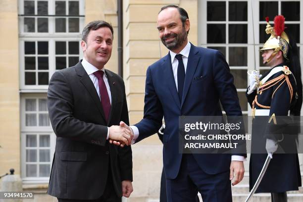 French Prime Minister Edouard Philippe welcomes Luxembourg Prime Minister Xavier Bettel upon his arrival at the Hotel de Matignon prior to a...