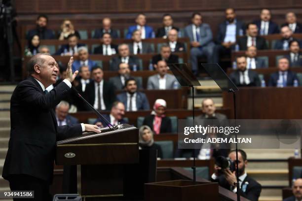 Turkish President and leader of the Justice and Development Party Recep Tayyip Erdogan gestures as he delivers a speech during the AK Party's...