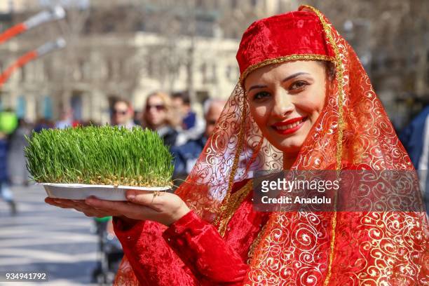 Azerbaijanis attend the Newroz celebrations in Baku, Azerbaijan on March 20, 2018. Nowruz marks the beginning of spring in the Northern Hemisphere....