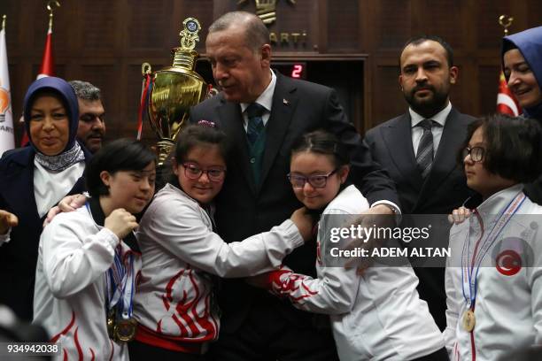 Turkish President and leader of the Justice and Development Party Recep Tayyip Erdogan meets children with Down Syndrome, on the eve of the World...