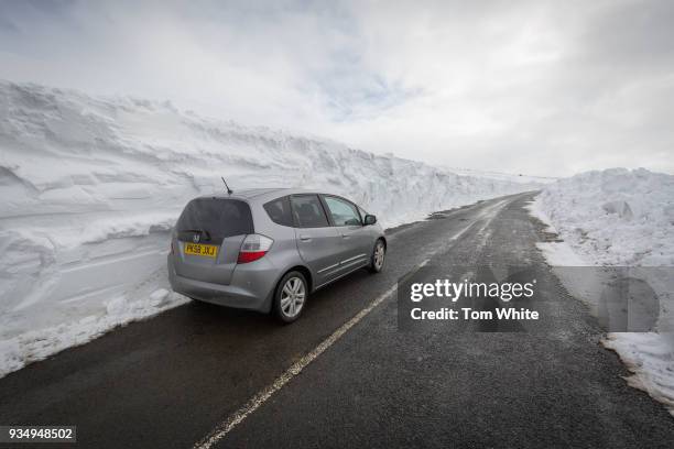 Car is surrounded by deep snow on a road in the Pennines on March 20, 2018 in Allenheads, England. Winter conditions are persisting in some parts of...