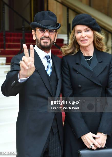 Ringo Starr, real name Richard Starkey, poses with his wife Barbara Bach as he arrives at Buckingham Palace to receive his Knighthood at an...