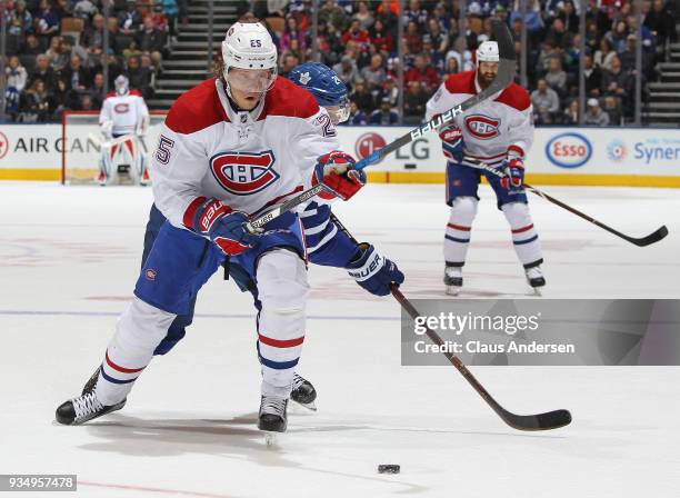 Jacob de la Rose of the Montreal Canadiens tries to gain control of the puck against the Toronto Maple Leafs during an NHL game at the Air Canada...