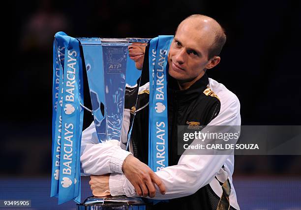 Nikolay Davydenko of Russia celebrates with the trophy after beating Juan Martin Del Potro of Argentina in the singles final match during the...