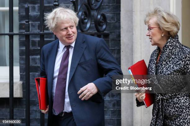 Boris Johnson, U.K. Foreign secretary, left, and Andrea Leadsom, U.K. Leader of the House of Commons, right, leave following a weekly meeting of...