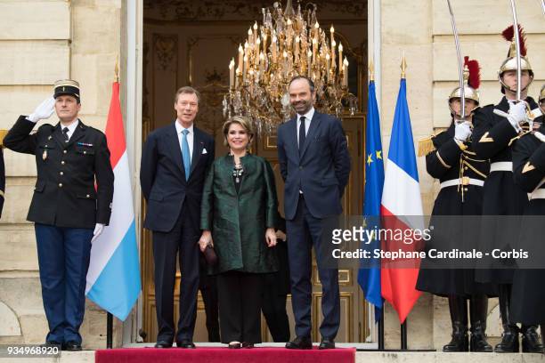 Grand-Duke Henri of Luxembourg, Grand-Duchess Maria Teresa of Luxembourg and French Prime Minister Edouard Philippe pose at the Hotel de Matignon on...