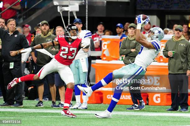 Robert Alford of the Atlanta Falcons against Brice Butler of the Dallas Cowboys at Mercedes-Benz Stadium on November 12, 2017 in Atlanta, Georgia.