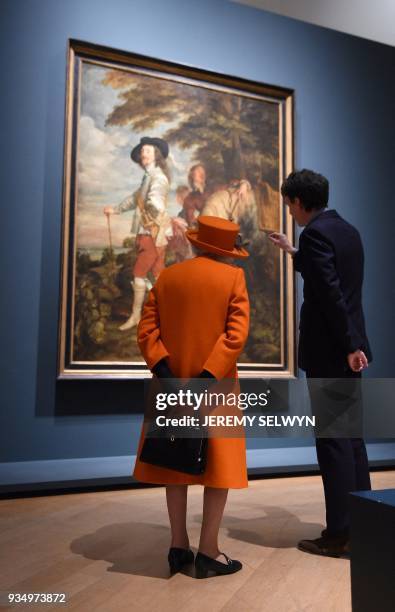 Britain's Queen Elizabeth II talks with curator Per Rumberg during her visit to the Royal Academy of Arts in London on March 20, 2018. The Royal...