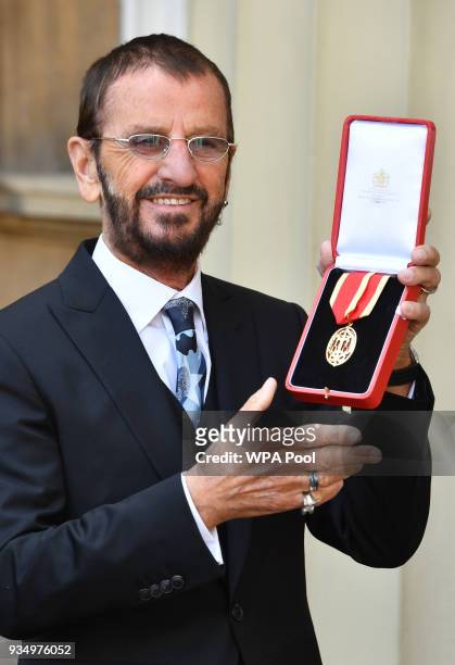 Ringo Starr, real name Richard Starkey, poses at Buckingham Palace after receiving his Knighthood at an Investiture ceremony on March 20, 2018 in...