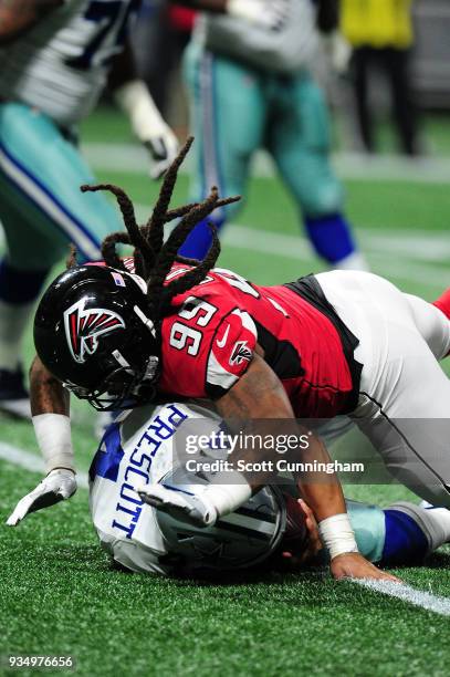 Dak Prescott of the Dallas Cowboys is sacked by Adrian Clayborn of the Atlanta Falcons at Mercedes-Benz Stadium on November 12, 2017 in Atlanta,...