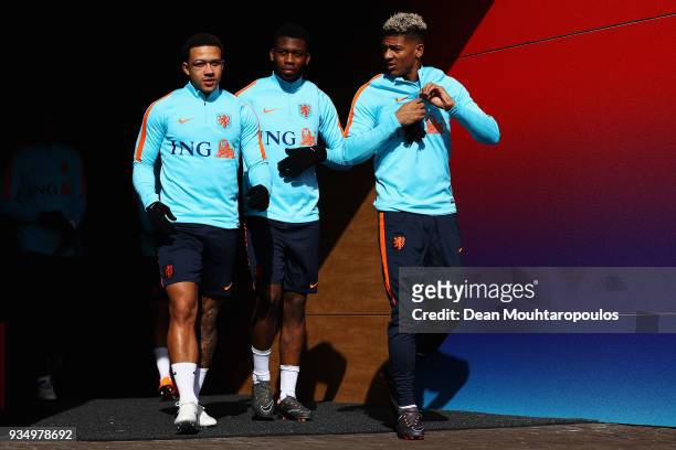 Memphis Depay, Timothy Fosu-Mensah and Patrick van Aanholt of the Netherlands walk out the players tunnel during the Netherlands Training session...