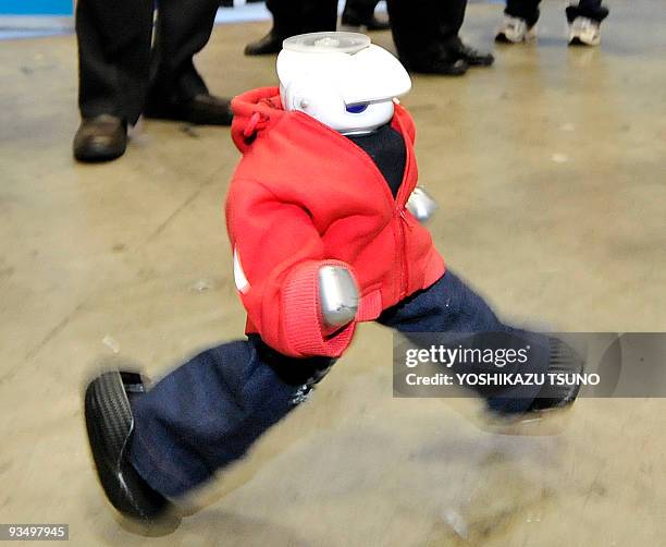 Humanoid robot "Manoi AT01", in height of 34cm and produced by Japan's toy robot maker Kyosho, performs a hip-hop dance at the International Robot...