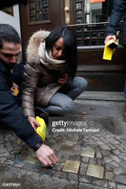 Berlin politician Sawsan Chebli, who is of Palestinian origin, participates in the spring cleaning of "Stolpersteine" memorials to Holocaust victims...