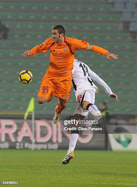 Cristiano Lucarelli of Livorno competes with Andrea Coda of Udinese during the Serie A match between Udinese and Livorno at Stadio Friuli on November...