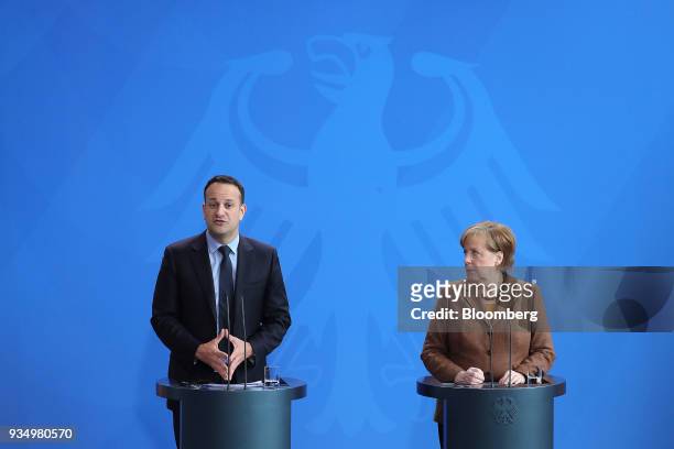 Leo Varadkar, Ireland's prime minister, left, speaks as he stands beside Angela Merkel, Germany's chancellor, during a news conference inside the...