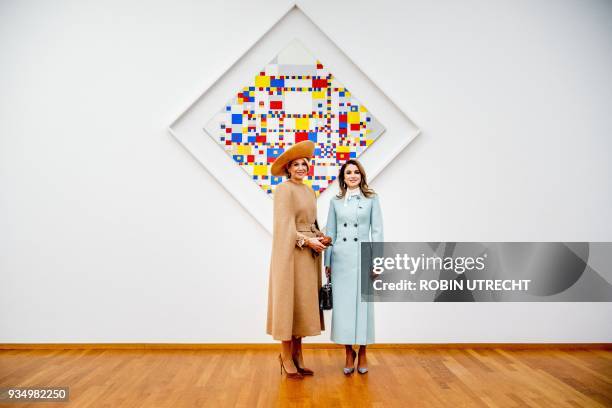 Dutch Queen Maxima and Queen Rania of Jordan pose in front of the work of art "Victory Boogie Woogie" by Dutch artist Piet Mondrian at the...