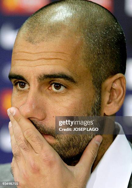 Barcelona's coach Pep Guardiola gives a press conference after a training session at Ciutat Esportiva Joan Gamper near Barcelona on November 28 a day...