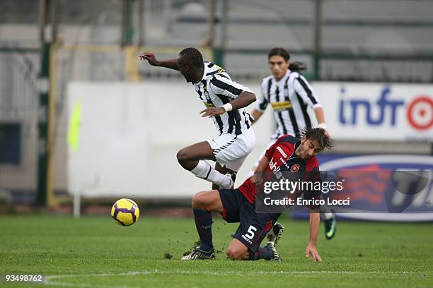 Daniele Conti of Cagliari competes for the ball with Sissoko Mohamed Lamine of Juventus FCduring the Serie A match between Cagliari and Juventus at...