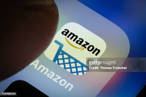 Berlin, Germany In this photo illustration the app of American electronic commerce and cloud computing company amazon is displayed on a smartphone on...