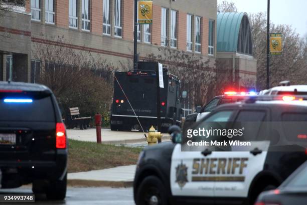 Police vehicles are parked in front of Great Mills High School after a shooting on March 20, 2018 in Great Mills, Maryland. It was reported that two...
