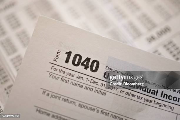 Department of the Treasury Internal Revenue Service 1040 Individual Income Tax forms for the 2017 tax year are arranged for a photograph in Tiskilwa,...