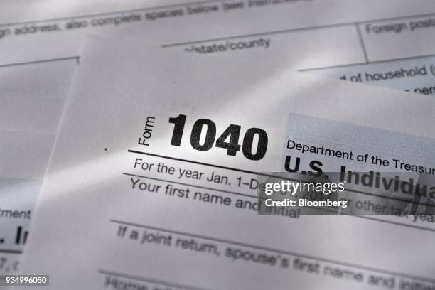 Department of the Treasury Internal Revenue Service 1040 Individual Income Tax forms for the 2017 tax year are arranged for a photograph in Tiskilwa,...