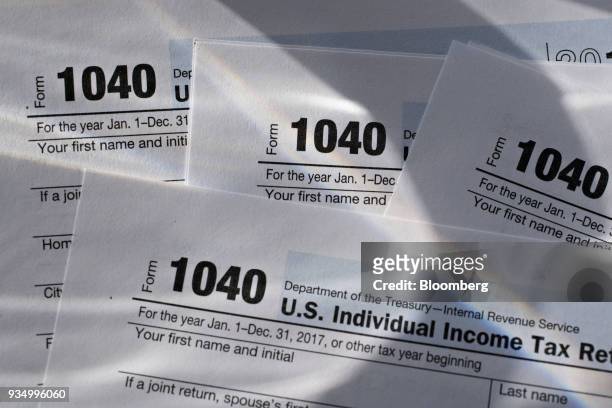 Department of the Treasury Internal Revenue Service 1040 Individual Income Tax forms for the 2017 tax year are arranged for a photograph in Tiskilwa,...