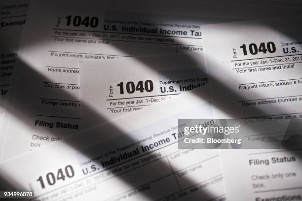 Department of the Treasury Internal Revenue Service 1040 Individual Income Tax forms for the 2017 tax year are arranged for a photograph in Tiskilwa,...